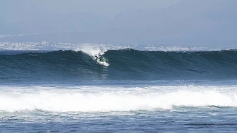 Skillful surfer surfing a big wave Stock Footage 71537628