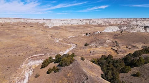 Skimming badlands bluff with drone Stock Footage 304806831