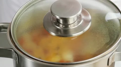 Skimming scum from the surface of vegetable stock Video stock 24667406