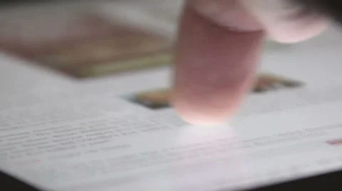 Skimming through a web page on touch tablet computer Stock Footage 8515348
