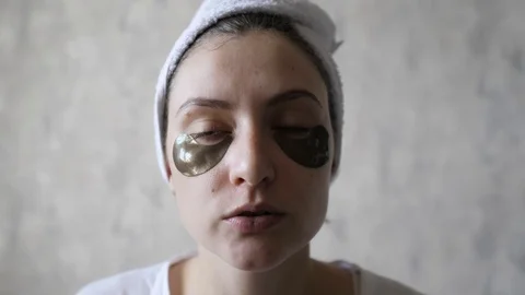 Skin Care - removing the patch under the eye, after a lifting procedure. Beauty Stock Footage 119990508
