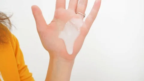 Skin cream flows down the arm Video stock 118166642