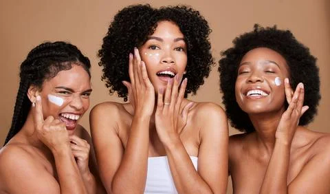 Skincare, beauty and black women, friends and face cream in studio on brown Stock Photos