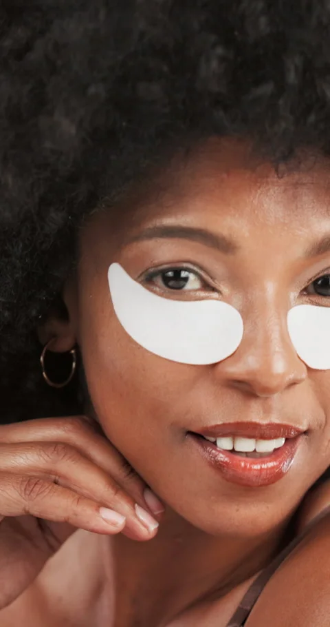 Skincare, eye patch and face of african woman for hydration, glow or facial Video stock 311617340