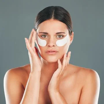 Skincare, eyes patch and portrait of woman, beauty and dermatology on studio Fotos de archivo