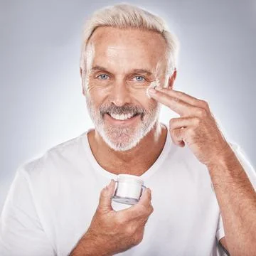 Skincare, face cream and senior man portrait on white background for beauty Stock Photos