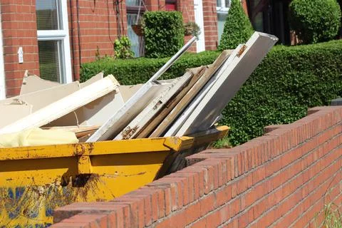 Skip full of wood Stock Photos