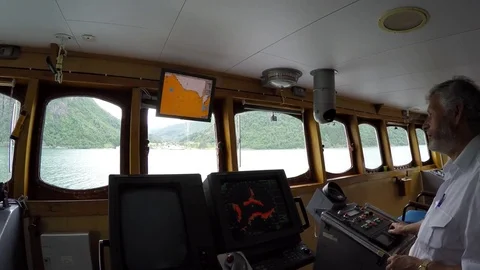 Skipper of a ferry which transports passengers, cars, buses in Fjords Видео 78120786