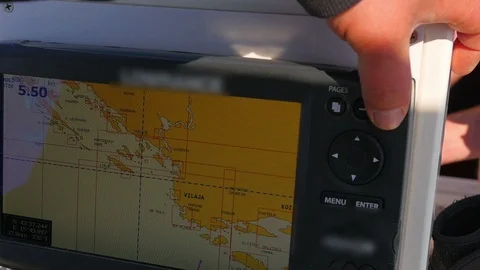 Skipper setting up course on sailing boats navigation gps plotter closeup. Stock Footage 90659436
