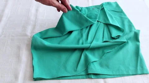 Skirt Folded with Care: Simple Steps for Neat, Tidy Packing Video stock 312505281