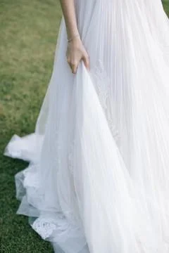 Skirts of the bride. Stock Photos
