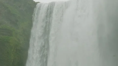 Skogafoss Medium Wide Slow Motion Pan Down 1 Stock Footage 173450430