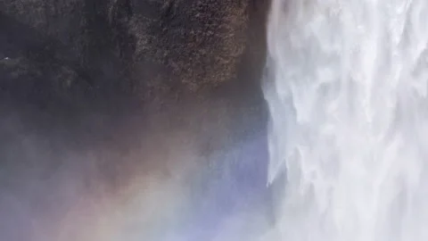 Skógafoss Waterfall forms a rainbow. Close-up view Natural Wonder. Stock Footage 108465609