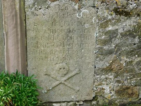 Skull and Cross Bones markings on gravestone on Lindisfarne (The Holy Island) Stock Photos