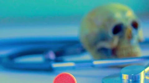 Skull and stethoscope with red pill, dark medical mystery concept Stock-Footage 341970203