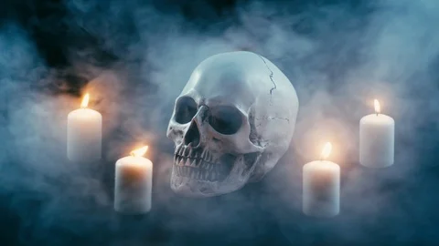 Skull between candles, halloween theme Stock Footage 94898199