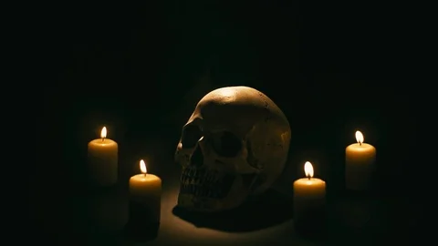 Skull between candles, halloween theme Stock Footage 94898525