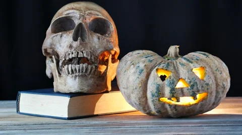 Skull on book and light in pumpkin 動画素材 55641293