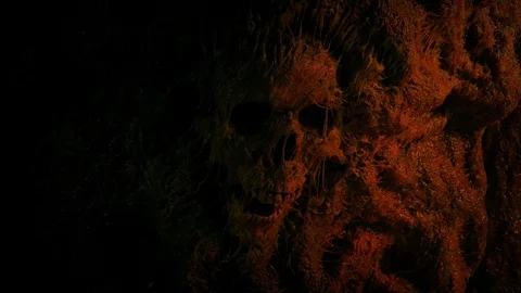 Skull In Cave Wall Lit Up In Fire Light Stock-Footage 121764613