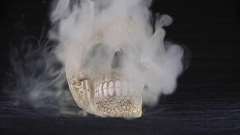 Skull covered in smoke on a dark background. Stock Footage 83391425
