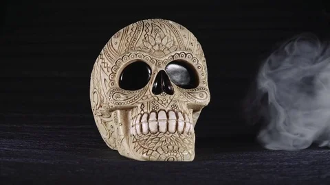 Skull covered in smoke on a dark background. Stock Footage 83391475