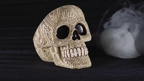 Skull covered in smoke on a dark background. Stock Footage 83391551