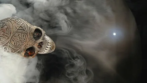 Skull covered in smoke on a dark background. top view Stock Footage 87545755