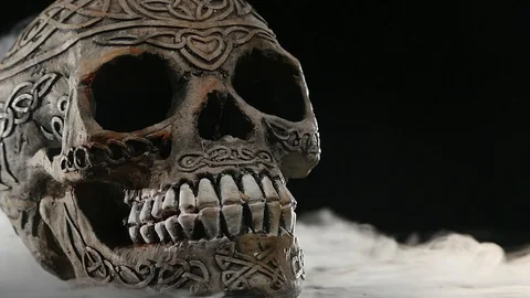 Skull covered in smoke on a dark background Stock Footage 87685482