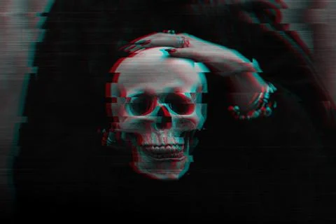 Skull of a dead man in the hands of a witch witch Stock Photos