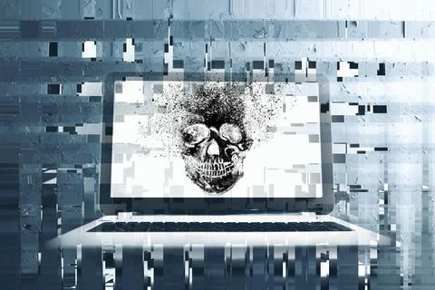 A skull is displayed on a laptop Stock Photos