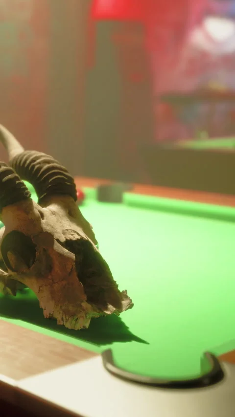 Skull on a green pool table in a dimly lit room Stock-Footage 342345581