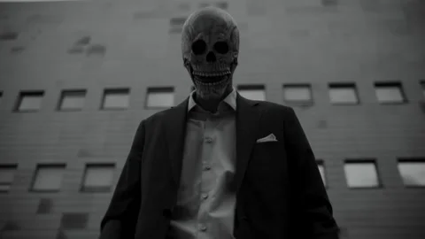 Skull Head Man in a Suit buttoning his shirt Stock-Footage 259886405