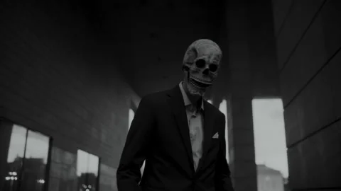 Skull Head Man in a Suit looking at the camera Vídeo Stock 259885457