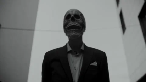 Skull Head Man Suit looking up Video stock 259887419