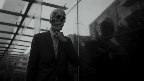 Skull Head Man in a Suit walking and fixing his tie Stock-Footage 259888908