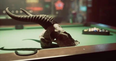 Skull with horns placed on a pool table in a dimly lit barroom Stock Illustration