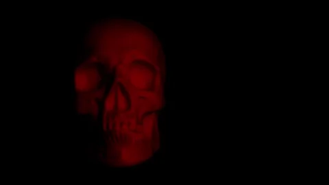 Skull lit by firelit in dark environment, horror film stock Stock Footage 250465372