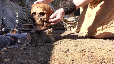 Skull man dug up around the fire 1 Video stock 163745918
