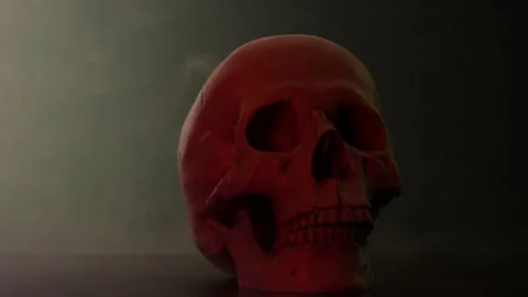 The skull of a man in smoke in red Video stock 156796098