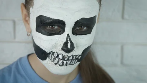 Skull pattern on the face. Halloween. Stock Footage 126030944