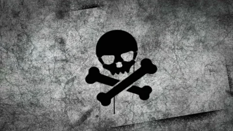 Skull piracy symbol spray painted on the concrete wall Stock Footage 149813402