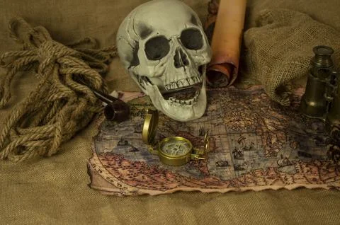 Skull represents the risks of adventure and explorations. Stock Photos