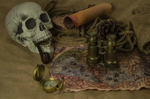 Skull represents the risks of adventure and explorations. Stock Photos