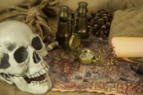 Skull represents the risks of adventure and explorations. Stock Photos