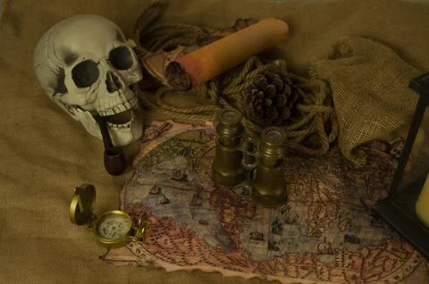 Skull represents the risks of adventure and explorations. Stock Photos