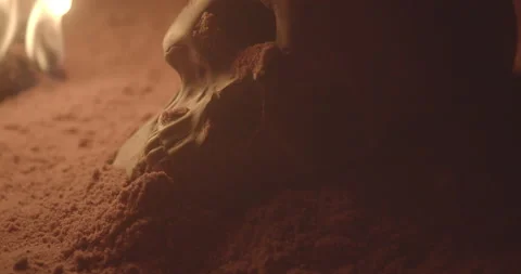 Skull in sand cave with fire Stock Footage 147145529