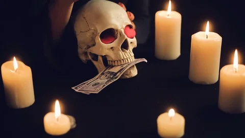 Skull with US Dollar bills in his mouth. Stock Footage 99091307