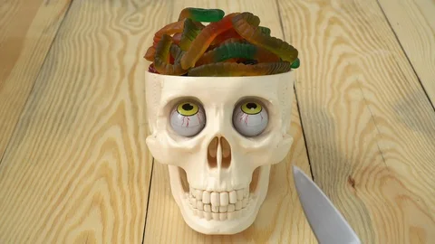 Skull with worm candies Stock Footage 113888721