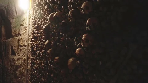 Skulls in heart shape and bones in Catacombs (4k 30p Slow Motion) Stock Footage 224090885