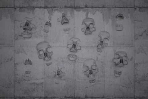 Skulls on a wall of concrete Stock Illustration